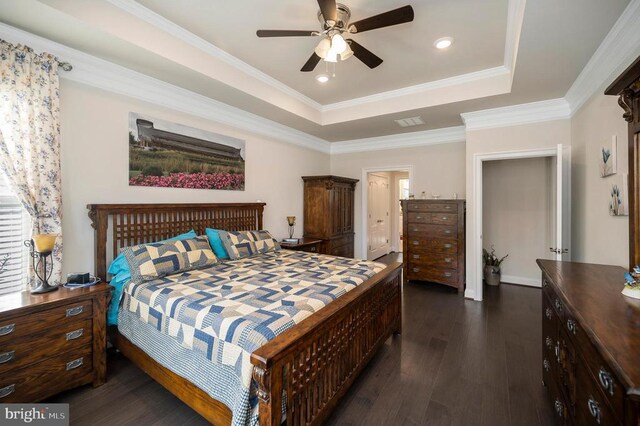 9822 White Oak Swamp Ct, Fredericksburg, VA 22407 - bedroom featuring dark wood-style floors, a tray ceiling, ornamental molding, and ceiling fan