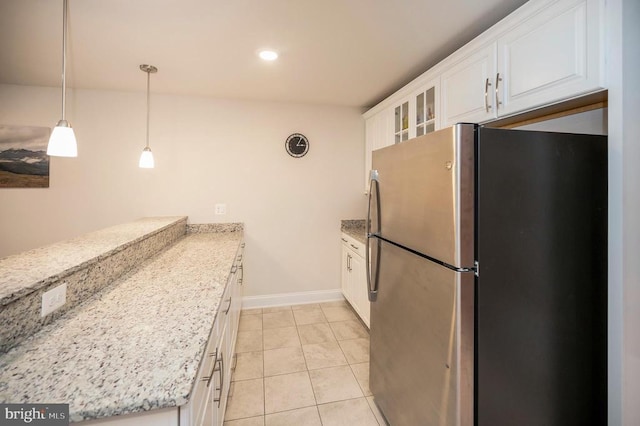 9822 White Oak Swamp Ct, Fredericksburg, VA 22407 - kitchen with freestanding refrigerator, white cabinets, baseboards, light tile patterned floors, and glass insert cabinets