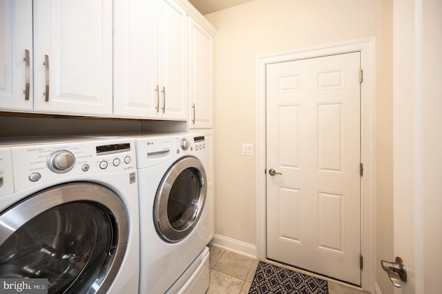 9822 White Oak Swamp Ct, Fredericksburg, VA 22407 - laundry room with washer and dryer, cabinet space, light tile patterned floors, and baseboards