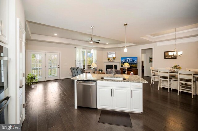 9822 White Oak Swamp Ct, Fredericksburg, VA 22407 - kitchen with a raised ceiling, dishwasher, a sink, dark wood-type flooring, and a fireplace
