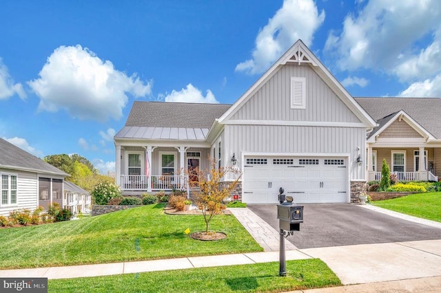 9822 White Oak Swamp Ct, Fredericksburg, VA 22407 - craftsman house featuring covered porch, board and batten siding, driveway, an attached garage, and a front yard