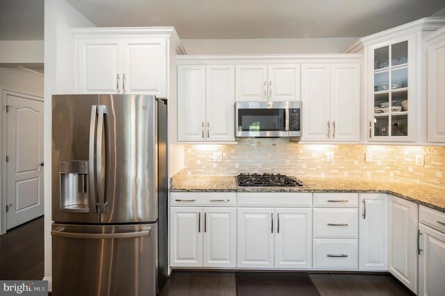 9822 White Oak Swamp Ct, Fredericksburg, VA 22407 - kitchen with appliances with stainless steel finishes, white cabinetry, light stone counters, and glass insert cabinets