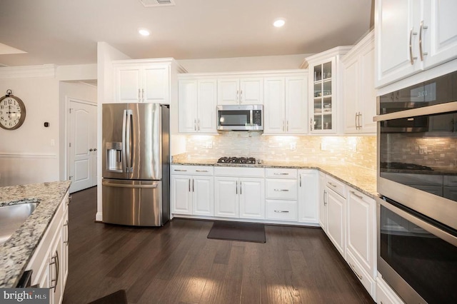9822 White Oak Swamp Ct, Fredericksburg, VA 22407 - kitchen featuring appliances with stainless steel finishes, white cabinetry, dark wood-style flooring, backsplash, and glass insert cabinets