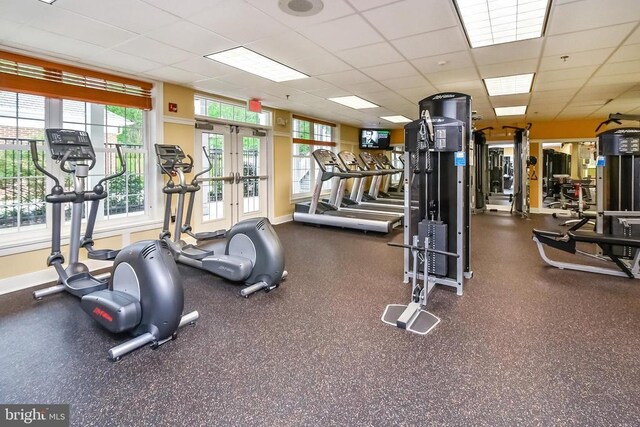 9822 White Oak Swamp Ct, Fredericksburg, VA 22407 - gym featuring baseboards, a paneled ceiling, and french doors