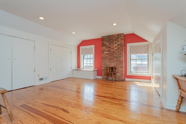 222 Grattan St E, Harrisonburg, VA 22801 - unfurnished living room with vaulted ceiling, light wood-type flooring, baseboards, and recessed lighting