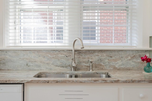 222 Grattan St E, Harrisonburg, VA 22801 - kitchen with a sink, tasteful backsplash, white cabinetry, and plenty of natural light