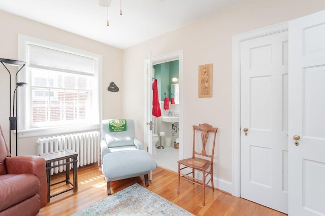222 Grattan St E, Harrisonburg, VA 22801 - sitting room featuring radiator and light wood-style floors