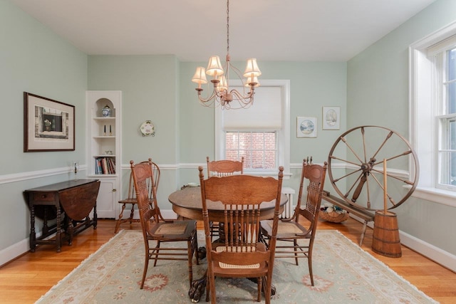 222 Grattan St E, Harrisonburg, VA 22801 - dining area with a chandelier, light wood-style floors, baseboards, and built in features