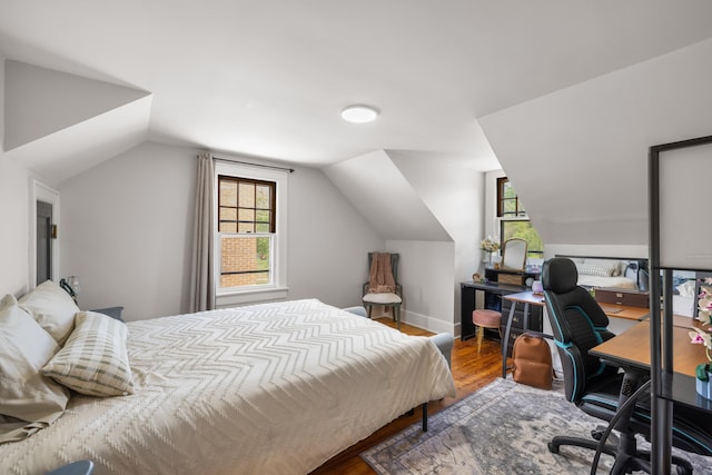 93 Eidson Creek Rd, Staunton, VA 24401 - bedroom featuring vaulted ceiling, multiple windows, wood finished floors, and a desk
