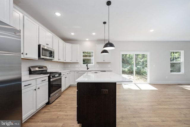 Old Lawyers Rd, Unionville, VA 22567 - kitchen featuring appliances with stainless steel finishes, light countertops, light wood-style flooring, a kitchen island, and recessed lighting