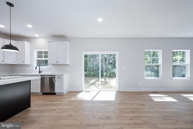 Old Lawyers Rd, Unionville, VA 22567 - kitchen featuring stainless steel dishwasher, light countertops, plenty of natural light, white cabinetry, and recessed lighting