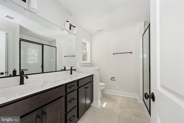 Old Lawyers Rd, Unionville, VA 22567 - full bathroom with a stall shower, toilet, baseboards, double vanity, and tile patterned floors