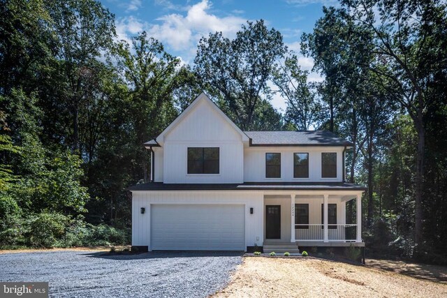 Old Lawyers Rd, Unionville, VA 22567 - modern inspired farmhouse featuring a porch, driveway, a garage, and roof with shingles