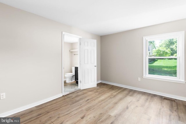 308 Virginia Ave, Mineral, VA 23117 - unfurnished bedroom featuring light wood-style flooring and ensuite bath