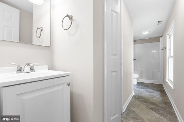 308 Virginia Ave, Mineral, VA 23117 - full bathroom featuring stone finish floors, vanity, plenty of natural light, and a shower