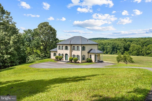 5442 Ellett Ln, Rixeyville, VA 22737 - view of front of home with metal roof, driveway, a front yard, a standing seam roof, and stucco siding