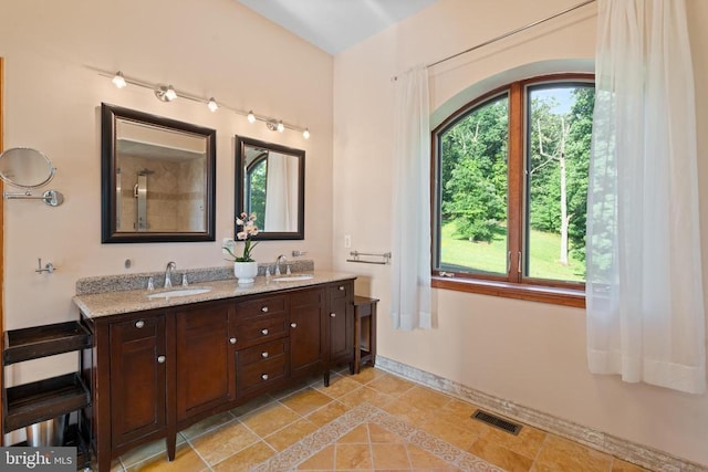 5442 Ellett Ln, Rixeyville, VA 22737 - full bathroom with tile patterned floors, double vanity, and baseboards
