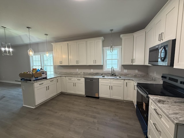 1526 2nd St, Waynesboro, VA 22980 - kitchen with black range with electric stovetop, dishwasher, a peninsula, and healthy amount of natural light