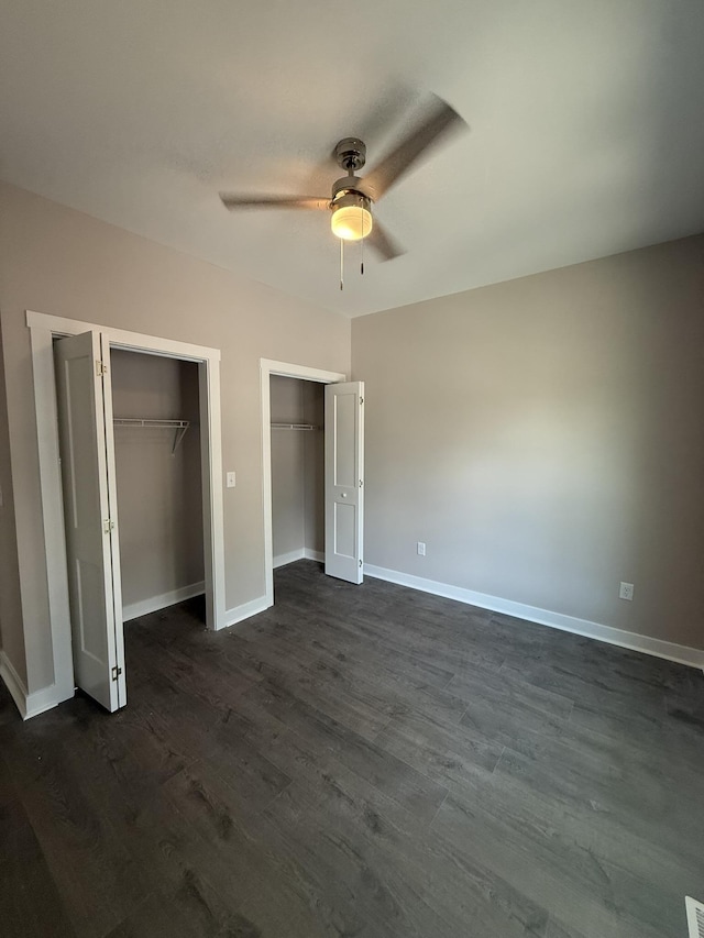 1526 2nd St, Waynesboro, VA 22980 - unfurnished bedroom featuring two closets, dark wood-style floors, and a ceiling fan