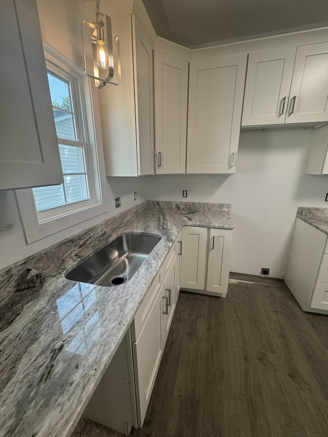 1526 2nd St, Waynesboro, VA 22980 - kitchen with light stone countertops, white cabinetry, dark wood-type flooring, a sink, and hanging light fixtures