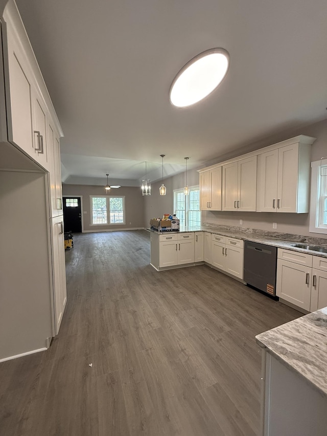 1526 2nd St, Waynesboro, VA 22980 - kitchen with dishwasher, a peninsula, white cabinets, and healthy amount of natural light