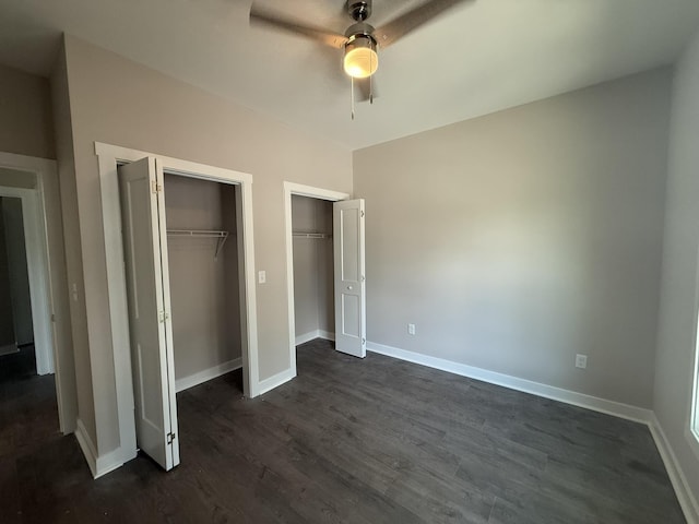 1526 2nd St, Waynesboro, VA 22980 - unfurnished bedroom with multiple closets, dark wood-style flooring, and a ceiling fan