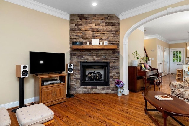 117 Villa View Dr, Staunton, VA 24401 - living area with a stone fireplace, wood finished floors, ornamental molding, and arched walkways