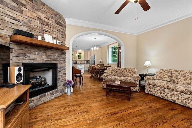 117 Villa View Dr, Staunton, VA 24401 - living room featuring a fireplace, ornamental molding, wood finished floors, arched walkways, and a ceiling fan