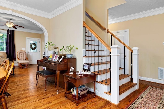 117 Villa View Dr, Staunton, VA 24401 - foyer featuring wood finished floors, a ceiling fan, crown molding, baseboards, and stairs
