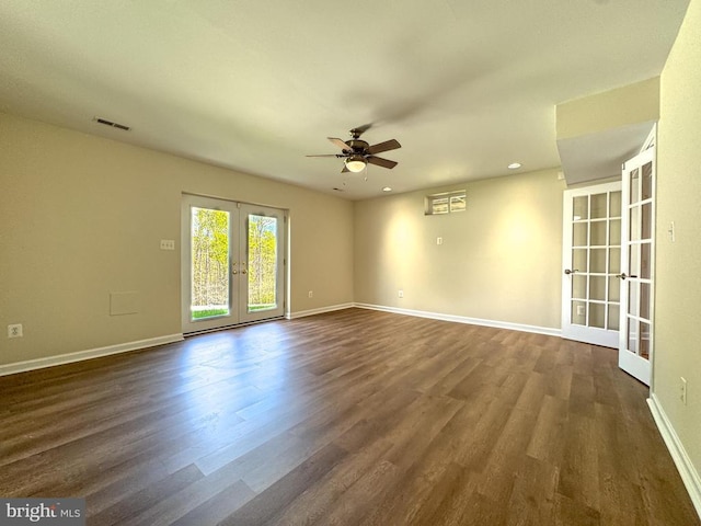 spare room featuring french doors, a ceiling fan, dark wood-style flooring, baseboards, and recessed lighting