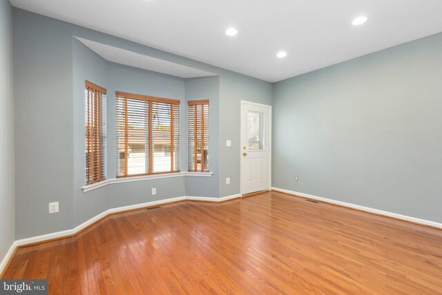 108 Monroe St, Locust Grove, VA 22508 - spare room with baseboards, hardwood / wood-style floors, plenty of natural light, and recessed lighting