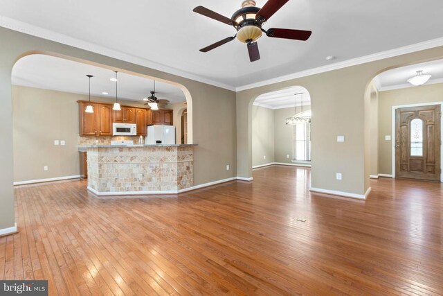 108 Monroe St, Locust Grove, VA 22508 - unfurnished living room featuring a ceiling fan, light wood-style flooring, baseboards, and crown molding
