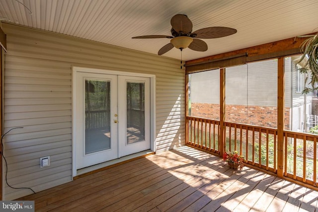 unfurnished sunroom featuring french doors and ceiling fan