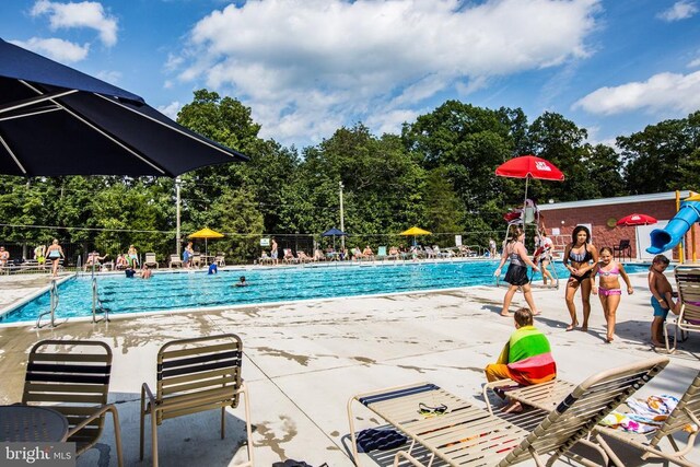108 Monroe St, Locust Grove, VA 22508 - community pool featuring fence, a patio area, and view of wooded area