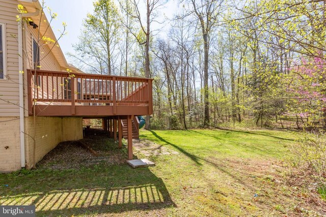 108 Monroe St, Locust Grove, VA 22508 - view of green lawn featuring a wooden deck and stairs