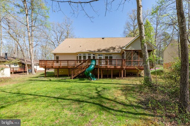 108 Monroe St, Locust Grove, VA 22508 - back of property featuring a sunroom, a deck, a shingled roof, a yard, and stairs