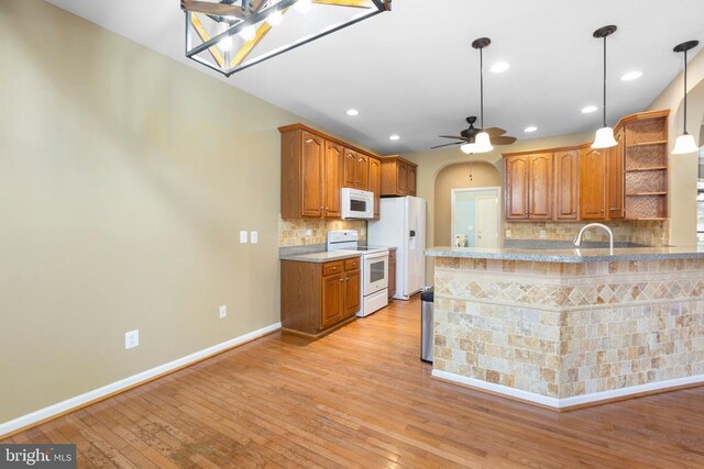 108 Monroe St, Locust Grove, VA 22508 - kitchen featuring white appliances, open shelves, light wood-style flooring, tasteful backsplash, and recessed lighting