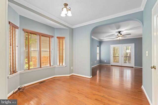 108 Monroe St, Locust Grove, VA 22508 - unfurnished room with arched walkways, wood finished floors, a ceiling fan, baseboards, and crown molding