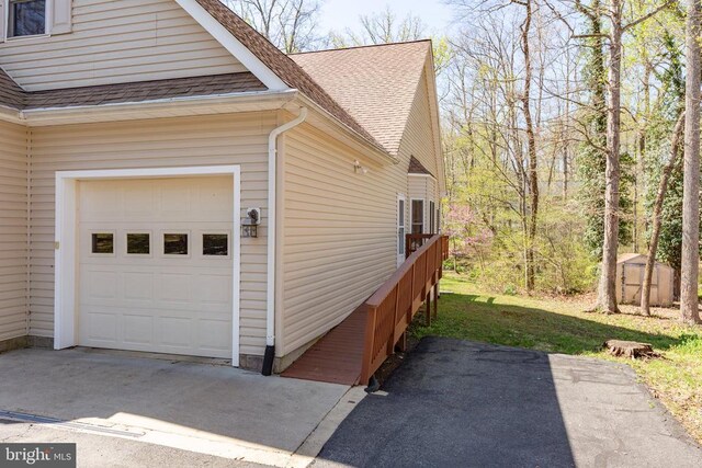 108 Monroe St, Locust Grove, VA 22508 - view of side of home with a shingled roof and a storage shed