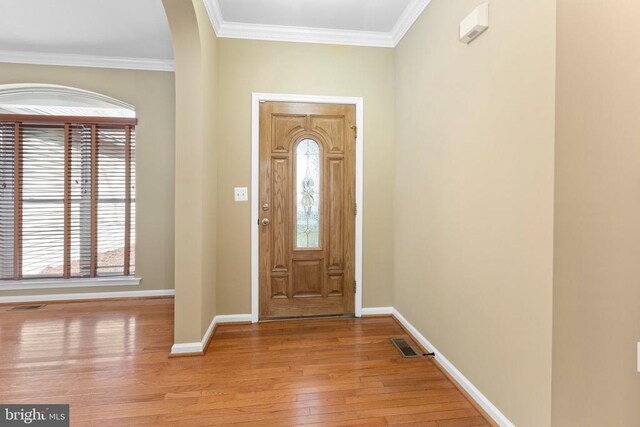 108 Monroe St, Locust Grove, VA 22508 - foyer featuring light wood-style flooring, healthy amount of natural light, arched walkways, baseboards, and ornamental molding