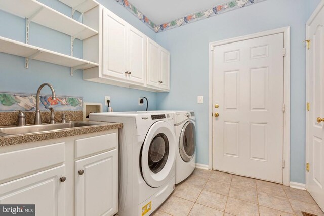 108 Monroe St, Locust Grove, VA 22508 - laundry area with cabinet space, light tile patterned flooring, separate washer and dryer, and baseboards