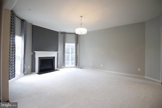 - unfurnished living room with carpet floors and a fireplace with flush hearth
