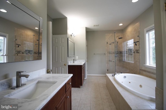  - bathroom with a stall shower, a jetted tub, two vanities, tile patterned floors, and recessed lighting