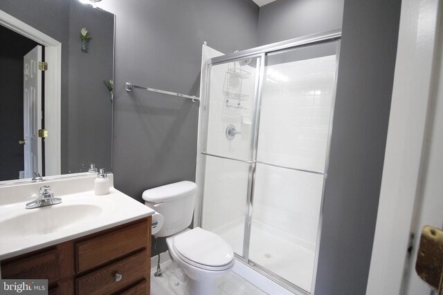  - full bath featuring a shower stall and vanity