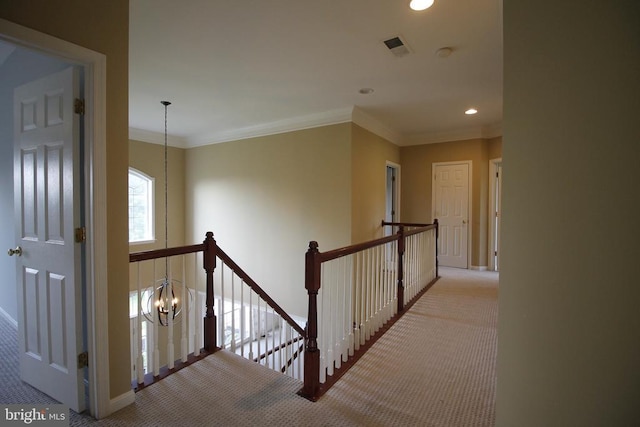 - corridor with an upstairs landing, carpet floors, recessed lighting, a chandelier, and ornamental molding