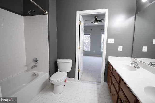  - bathroom with ceiling fan, double vanity, tile patterned floors, and tub / shower combination