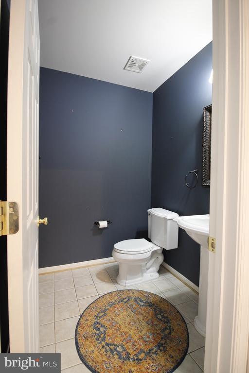  - half bathroom featuring tile patterned flooring