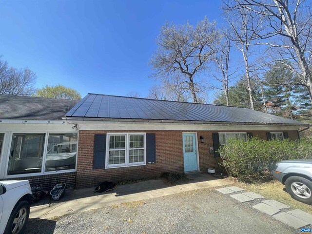 3133 Burnley Station Rd, Barboursville, VA 22923 - view of front of property featuring brick siding, a standing seam roof, and metal roof