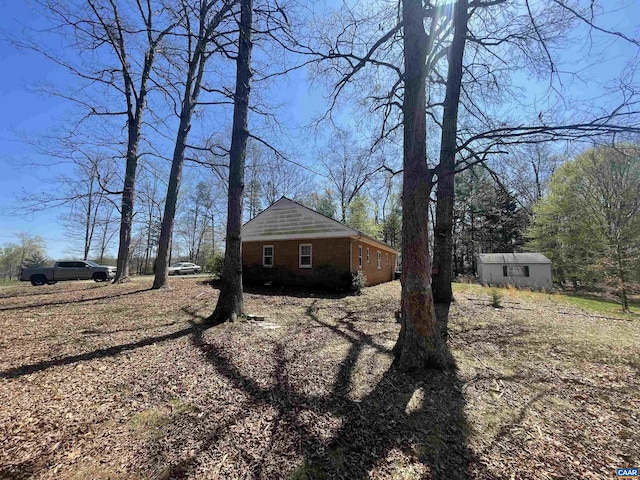 3133 Burnley Station Rd, Barboursville, VA 22923 - view of property exterior with brick siding and an outbuilding