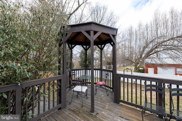wooden deck featuring a gazebo
